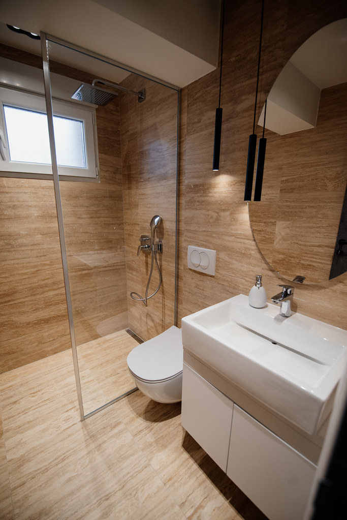 Modern bathroom renovation with glass shower and contemporary design